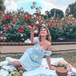 lightweight gauzy cotton in a sweet gingham print and flattering silhouette.